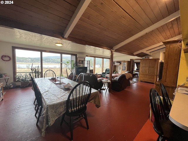 dining area with wood ceiling and vaulted ceiling with beams