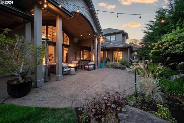 patio terrace at dusk with an outdoor living space