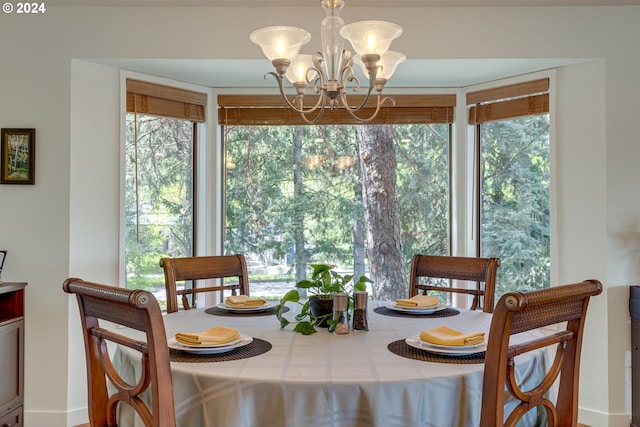 dining area featuring an inviting chandelier