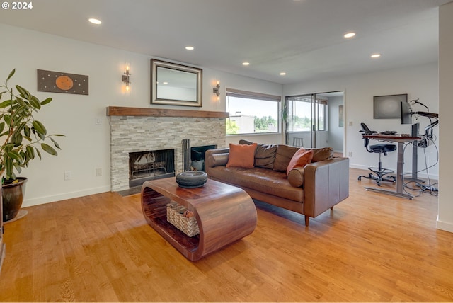 living room featuring light hardwood / wood-style floors and a fireplace