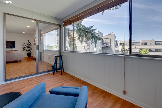 living area with a healthy amount of sunlight and light wood-type flooring