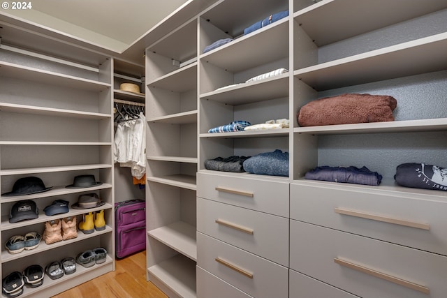 spacious closet featuring light hardwood / wood-style floors