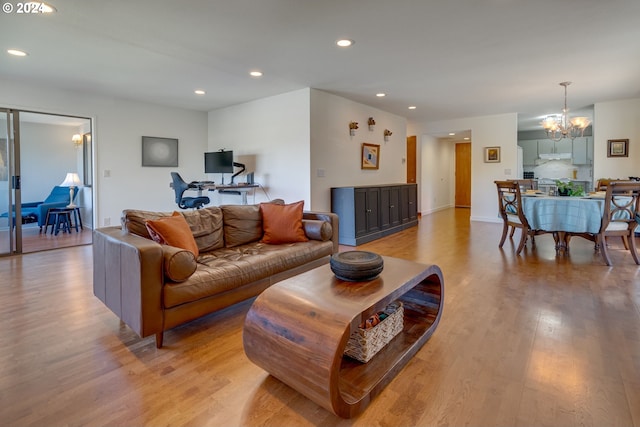 living room featuring a chandelier and hardwood / wood-style flooring