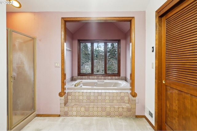 bathroom with independent shower and bath and lofted ceiling