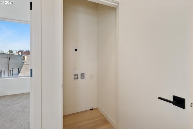 washroom featuring hookup for an electric dryer and carpet flooring