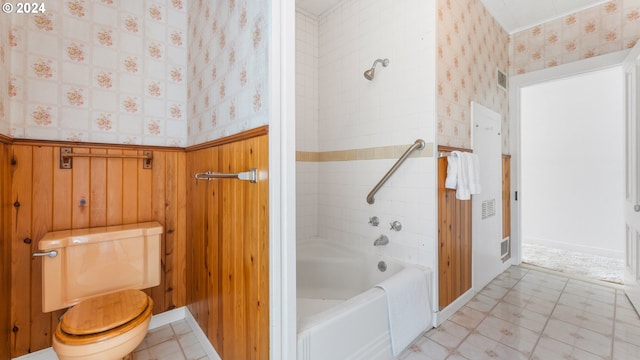 bathroom with toilet, shower / bath combination, visible vents, and wallpapered walls