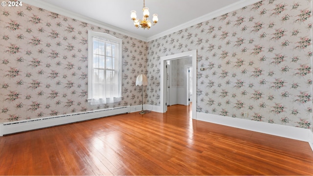 empty room featuring an inviting chandelier, crown molding, light wood-type flooring, baseboards, and baseboard heating