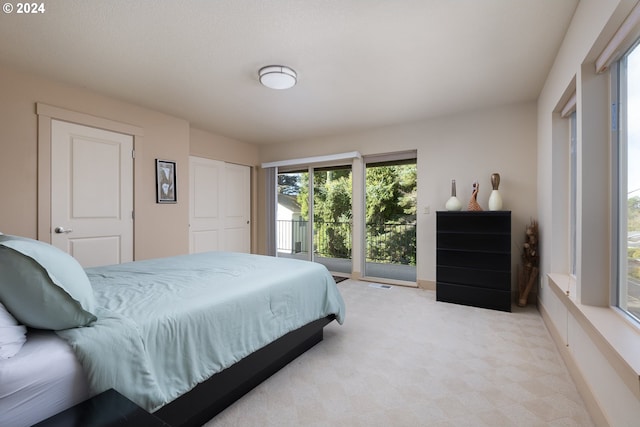 bedroom with light colored carpet