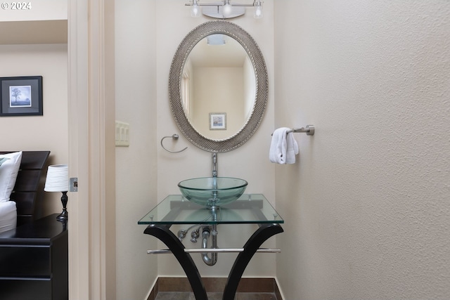 2777 NW Neptune Ave, Lincoln City, OR 97367 - bathroom featuring a sink and baseboards