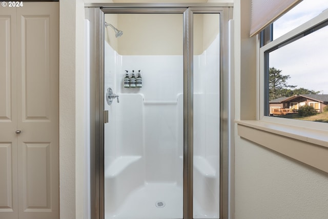 2777 NW Neptune Ave, Lincoln City, OR 97367 - bathroom featuring a stall shower and a textured wall