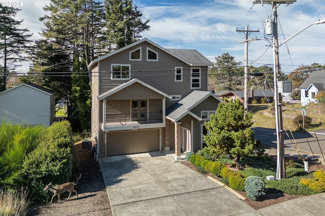 front facade with central AC unit and a garage