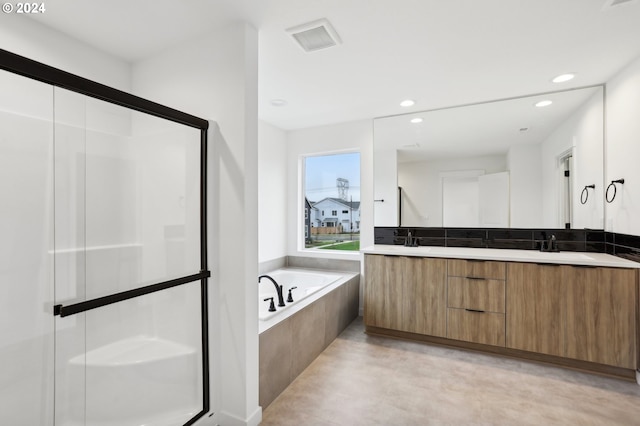 bathroom featuring separate shower and tub and vanity