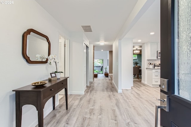 entrance foyer with light hardwood / wood-style flooring