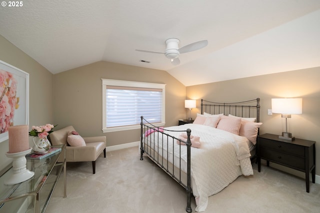 carpeted bedroom with ceiling fan and lofted ceiling