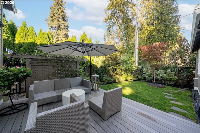 wooden terrace featuring a yard and an outdoor living space