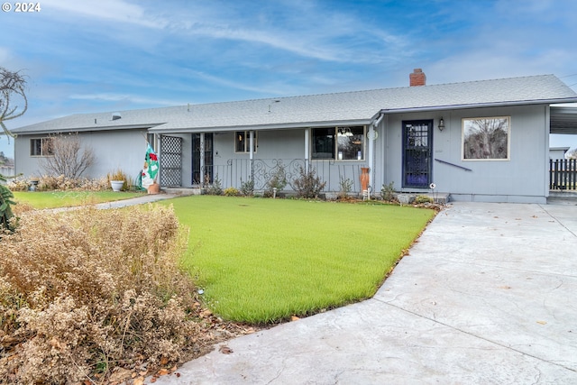 ranch-style house with a front yard