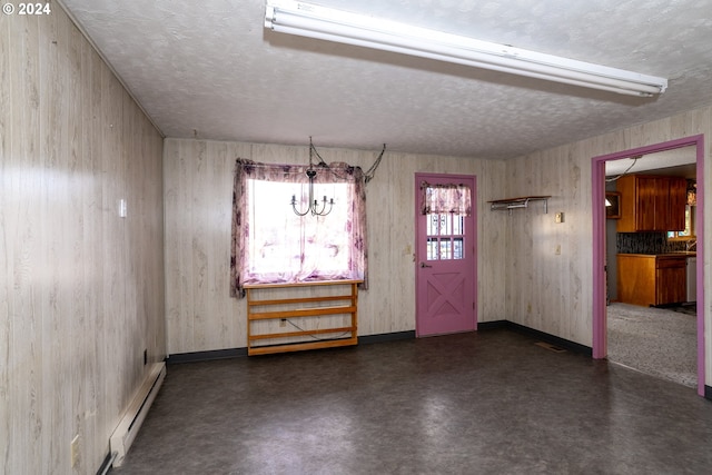 interior space featuring a textured ceiling and a baseboard radiator