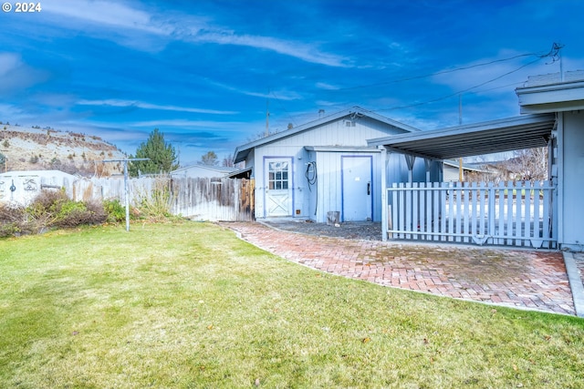 view of outbuilding featuring a yard