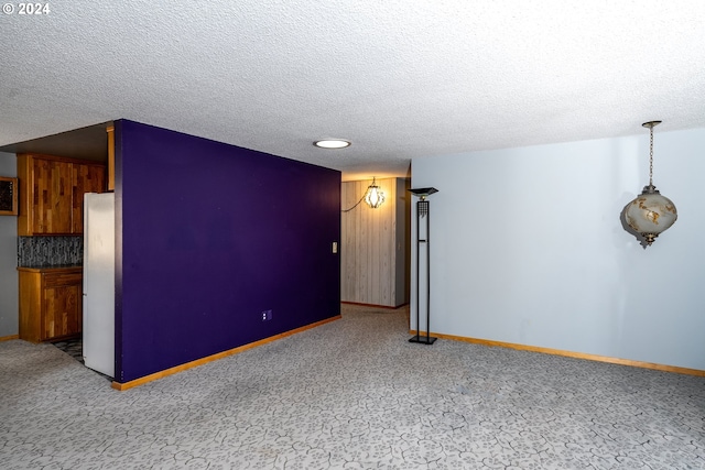 empty room featuring a textured ceiling