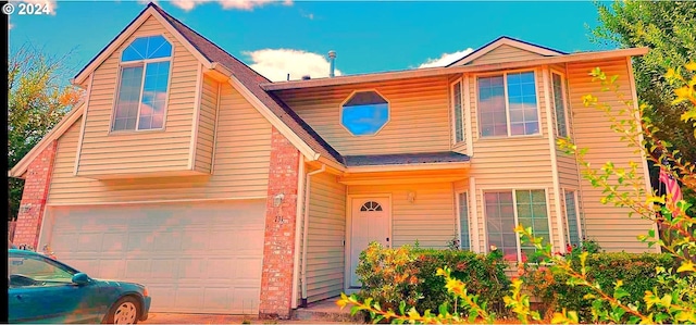 view of front of property with a garage