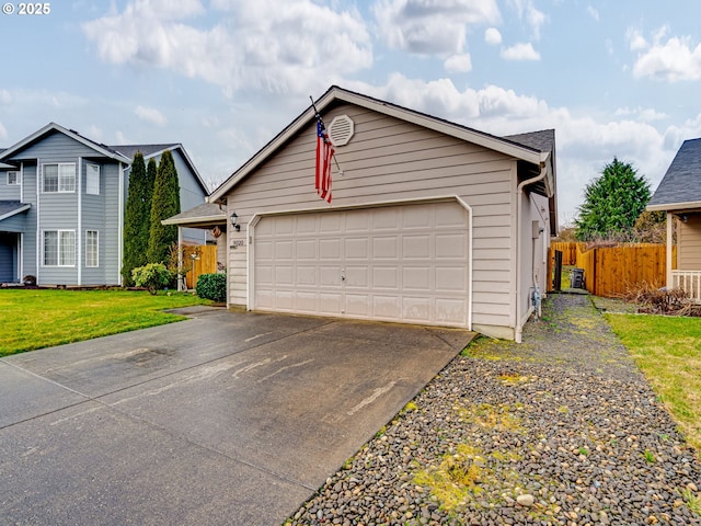 view of front facade with a garage, fence, and a front yard