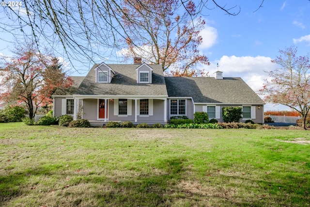 cape cod-style house with a porch and a front yard