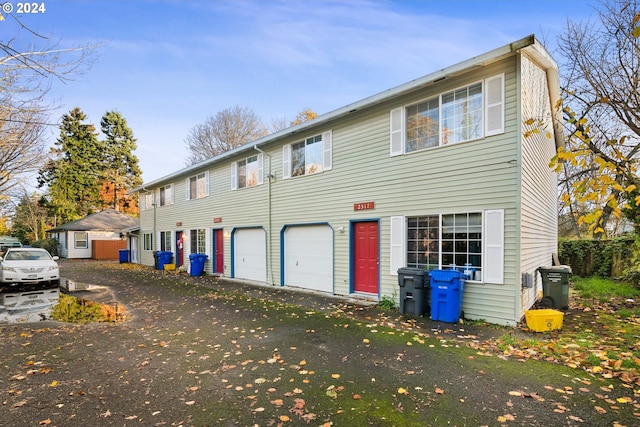 colonial inspired home featuring a garage