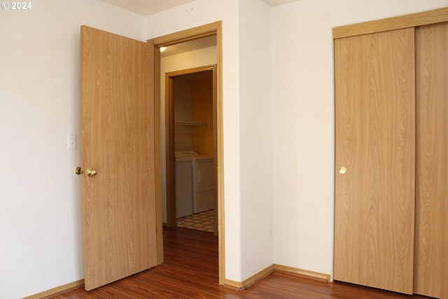 interior space with hardwood / wood-style floors and washing machine and dryer