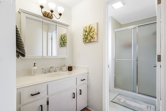 bathroom with a stall shower and vanity