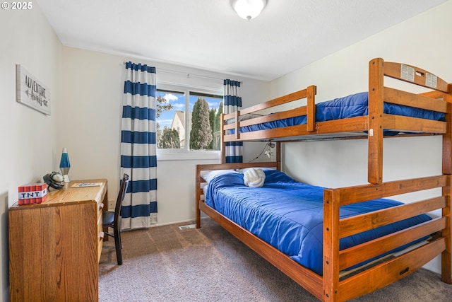 carpeted bedroom with baseboards