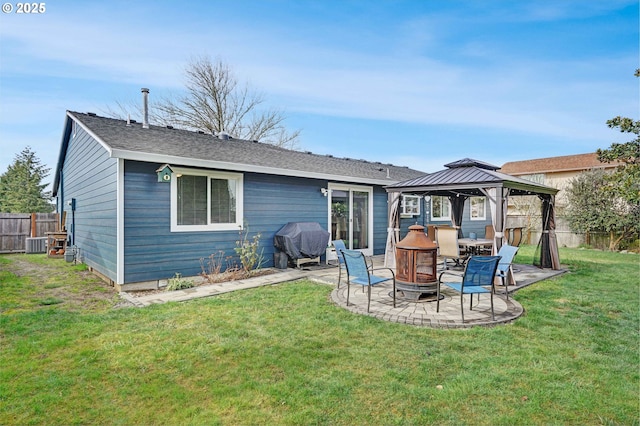 rear view of house featuring central AC unit, a patio, a gazebo, fence, and a yard