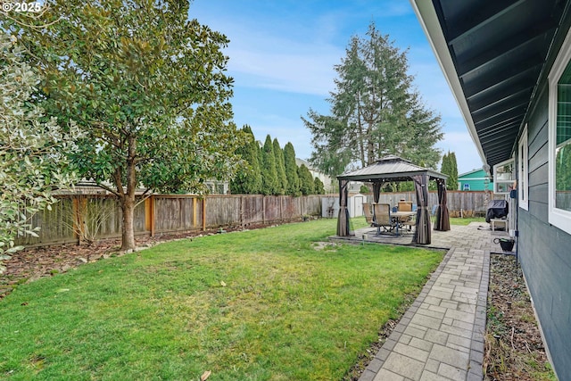 view of yard featuring a fenced backyard, a patio, and a gazebo