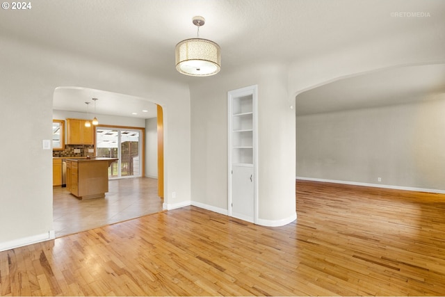 empty room with light wood-type flooring