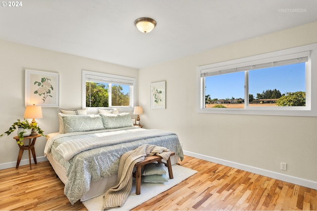 bedroom with light hardwood / wood-style floors