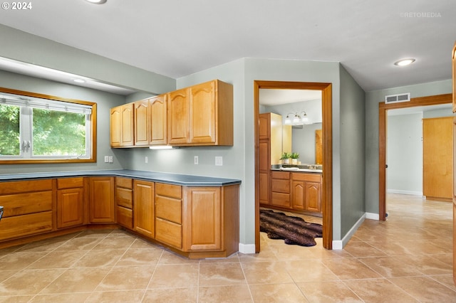 kitchen with light tile patterned flooring