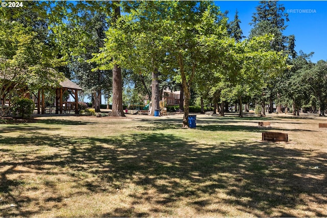 view of home's community with a gazebo and a yard