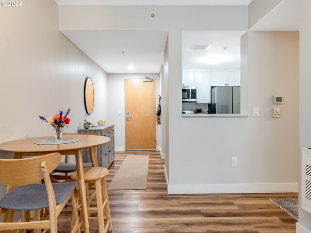 dining area featuring hardwood / wood-style flooring