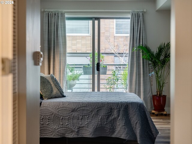 bedroom featuring a closet and light wood-type flooring