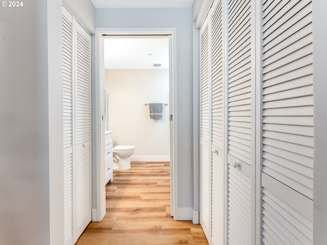 hall with light wood-type flooring