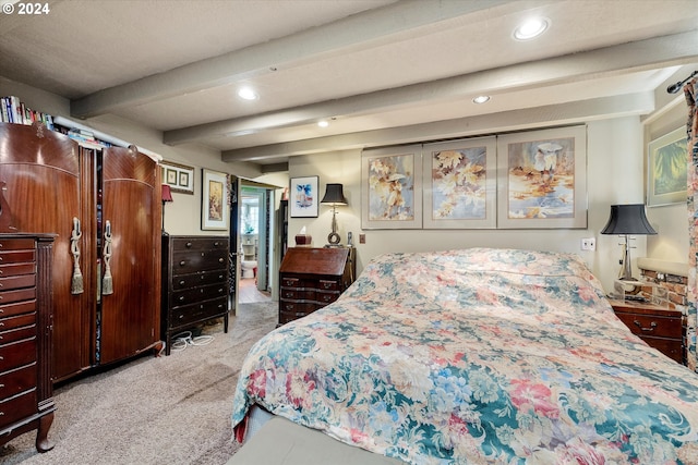 carpeted bedroom featuring beamed ceiling