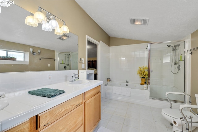 bathroom featuring tile patterned flooring, a textured ceiling, vanity, and toilet