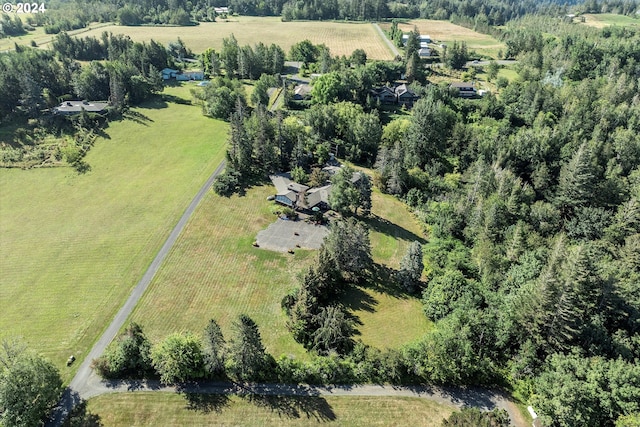 birds eye view of property with a rural view