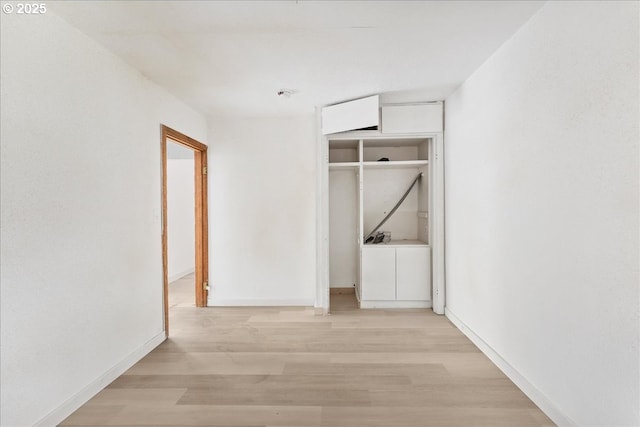 corridor featuring light hardwood / wood-style flooring