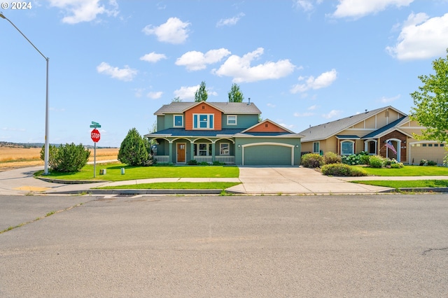 view of front facade with a front yard and a garage