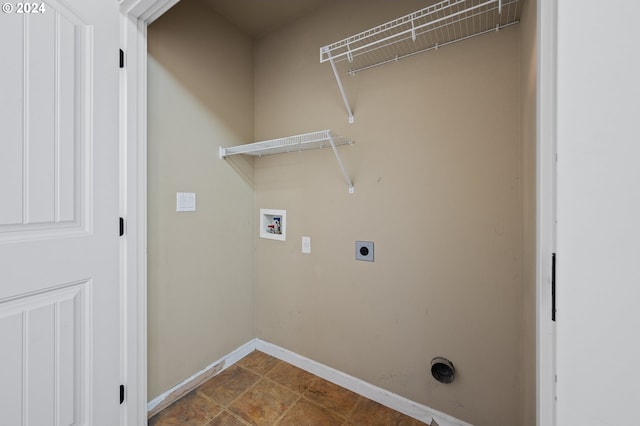 clothes washing area featuring hookup for a washing machine, hookup for an electric dryer, and tile patterned flooring