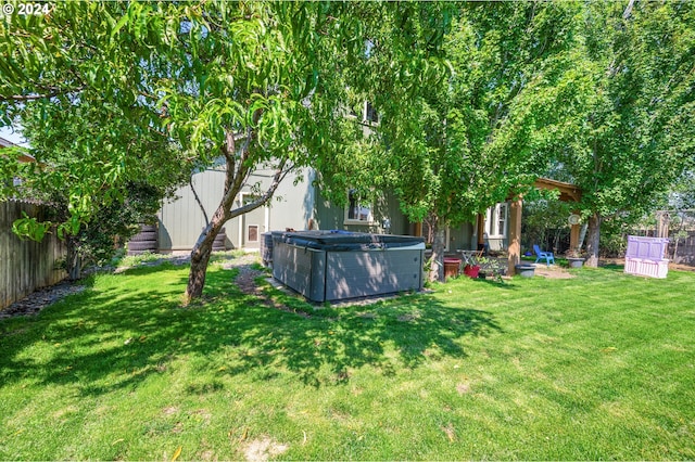 view of yard featuring a hot tub