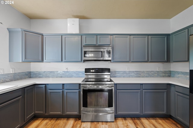 kitchen featuring light hardwood / wood-style flooring and stainless steel appliances