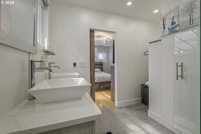 bathroom with tile patterned flooring and vanity