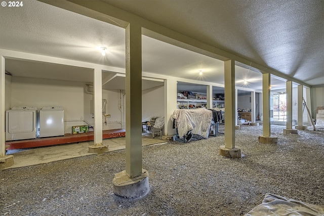 exterior space with a textured ceiling and washing machine and clothes dryer