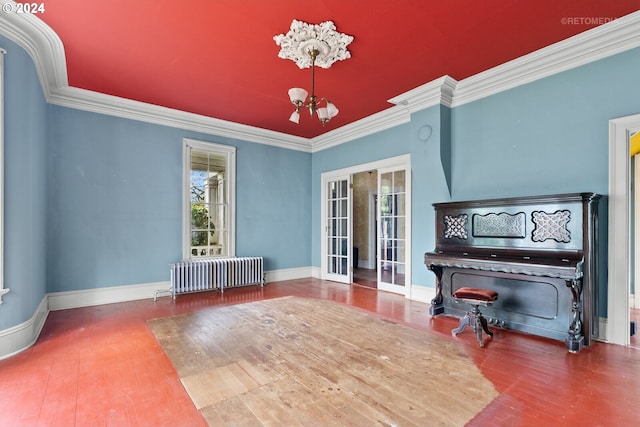 misc room with a notable chandelier, a healthy amount of sunlight, french doors, and radiator